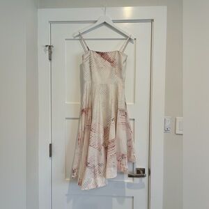 Knee length, a-line high waist corset body dress with white checker pattern.